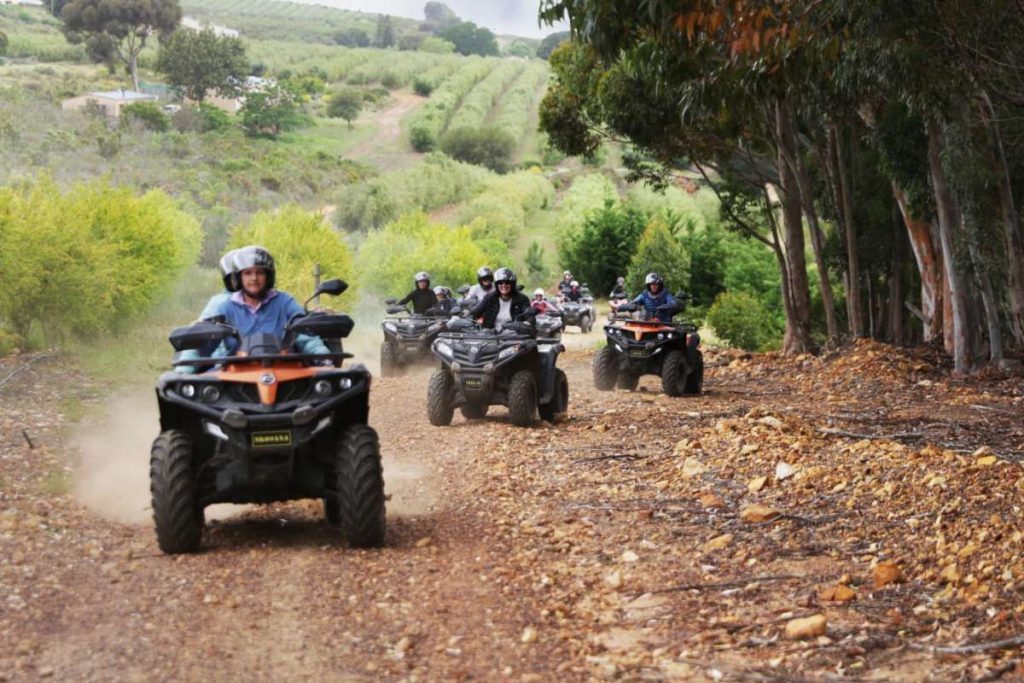 Group driving up mountain track